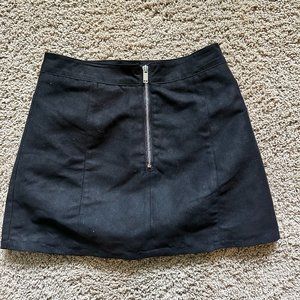 Black mini skirt with a sliver front zipper